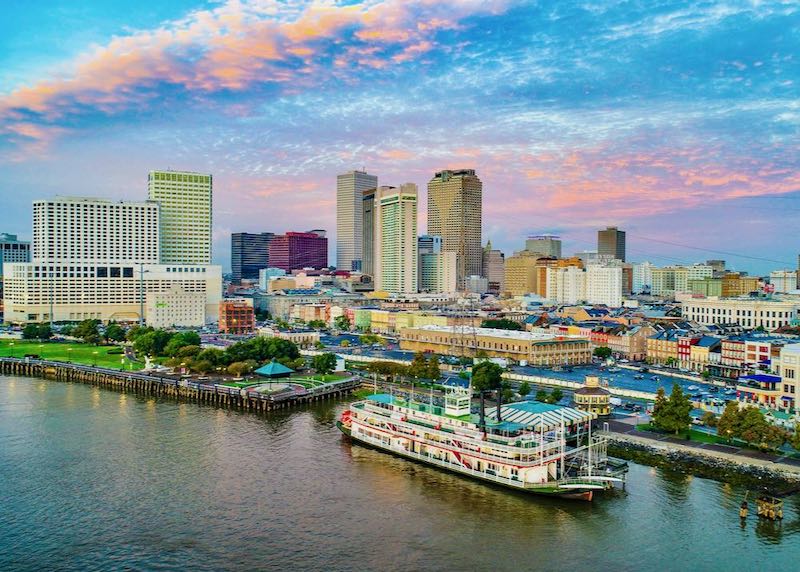 New Orleans cityscape with a steamboat.