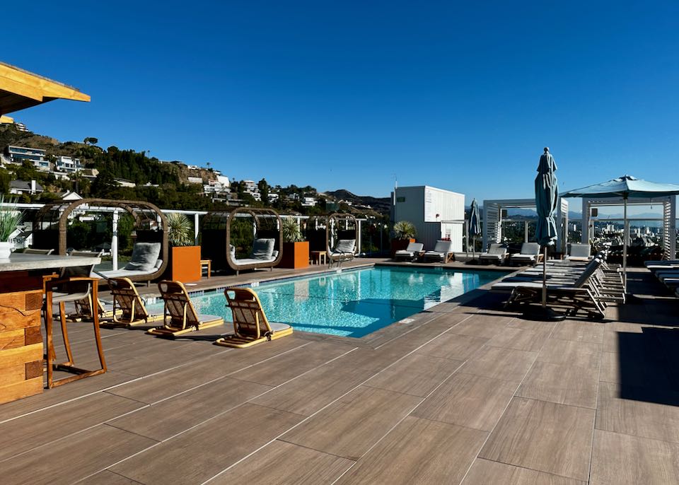 Hotel with rooftop pool and bar.